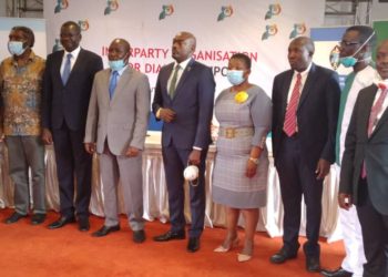 NRM SG Lumumba (3R) pose for a group photo with other Political Party leaders at IPOD Council meeting.