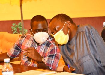 NRM deputy secretary general Todwong consults with Director Mobilisation Mathias Kasamba.