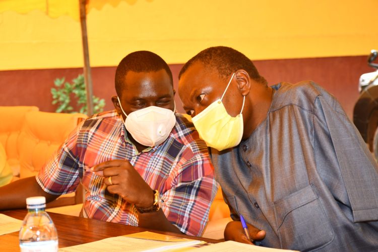 NRM deputy secretary general Todwong consults with Director Mobilisation Mathias Kasamba.